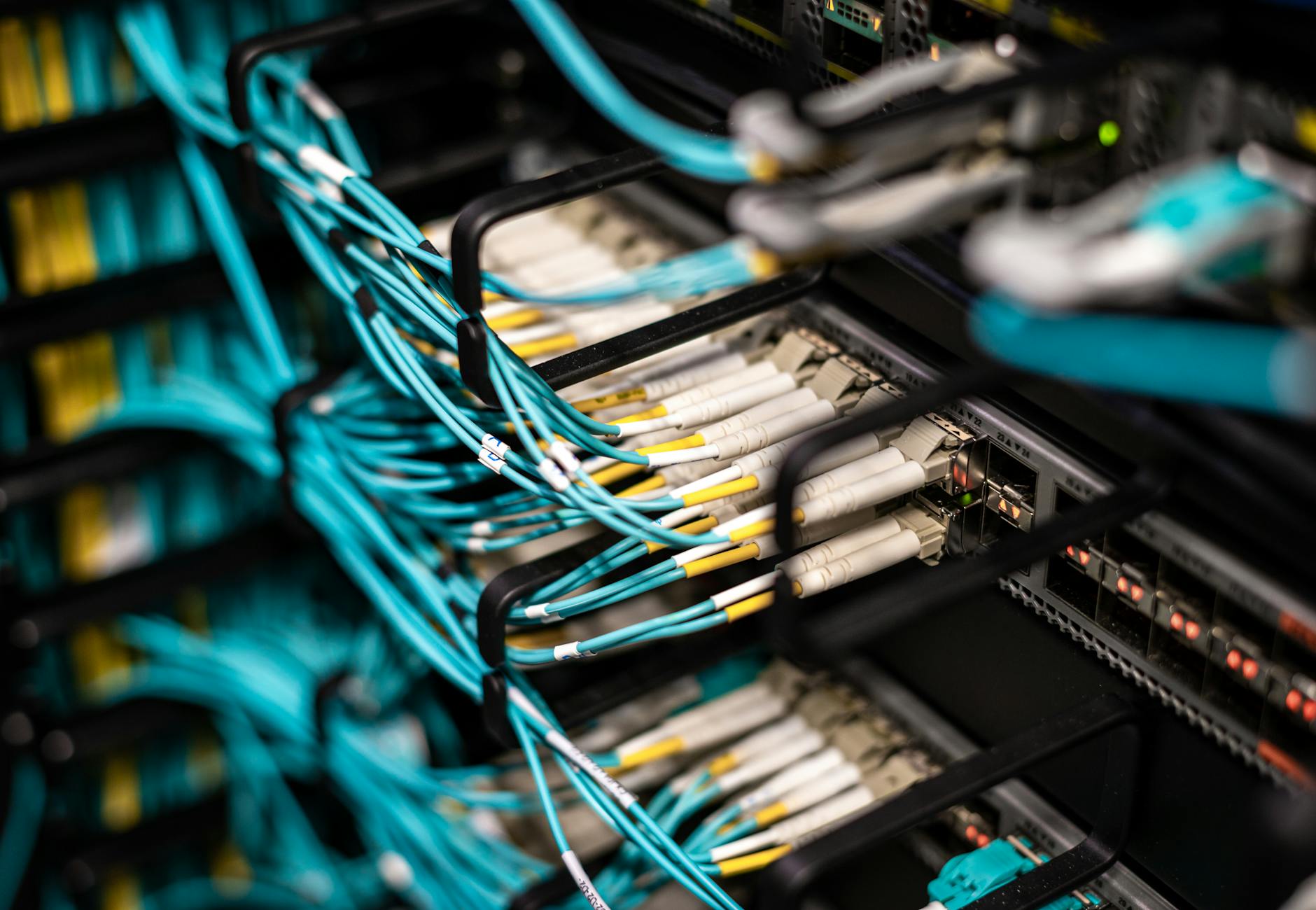 Numerous wires and cables mounted into server patch panel in modern data center